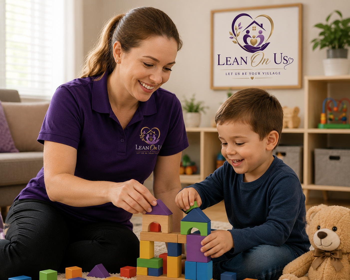 A Lean On Us caregiver smiling and playing with a young child while building with colorful blocks